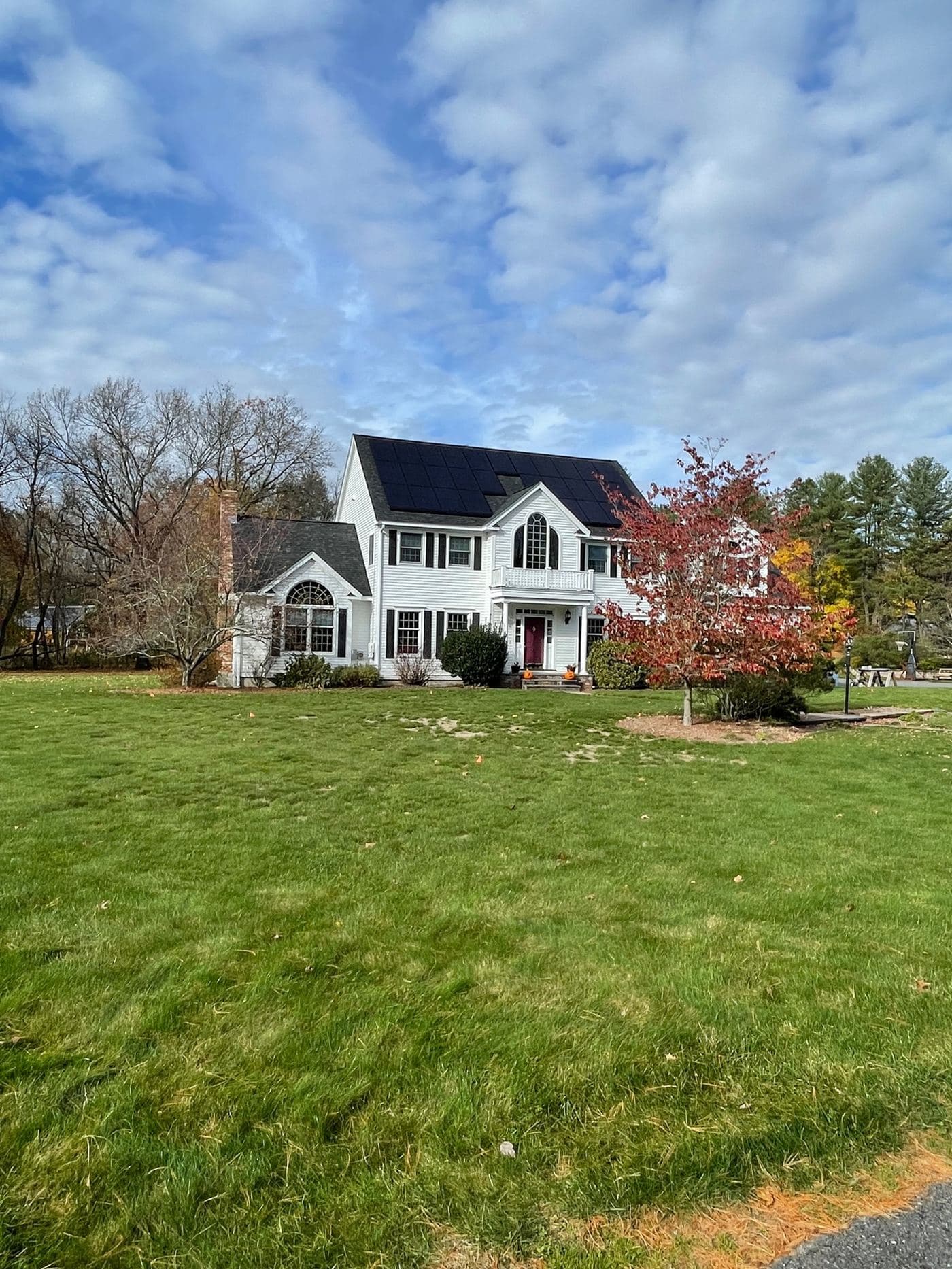 REC solar panels installed on a two-story home