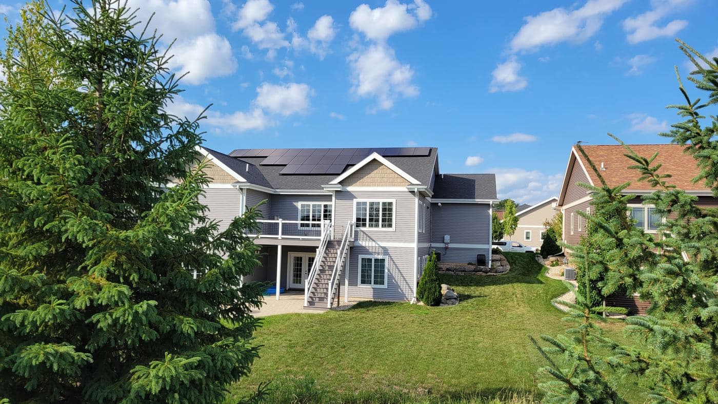 REC solar panels installed on a suburban home